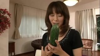 Japanese mother masturbating with a big cucumber