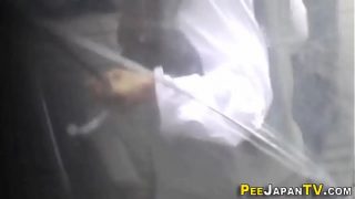 Teen asian pees outside