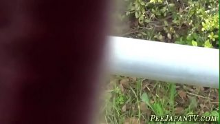 Fetish asian whore peeing in alleyway